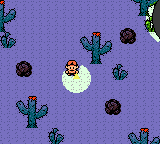 A UFO passes over a lone traveler in the desert.