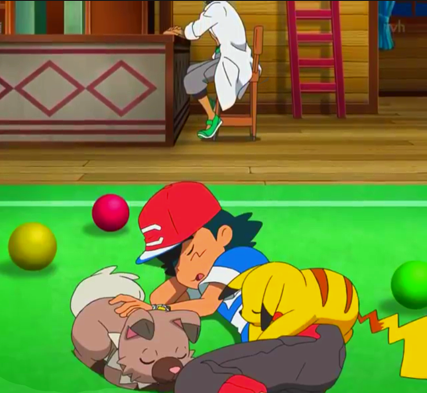 Professor Kukui looks on fondly at Ash, who is napping on the carpet with Rockruff and Pikachu.